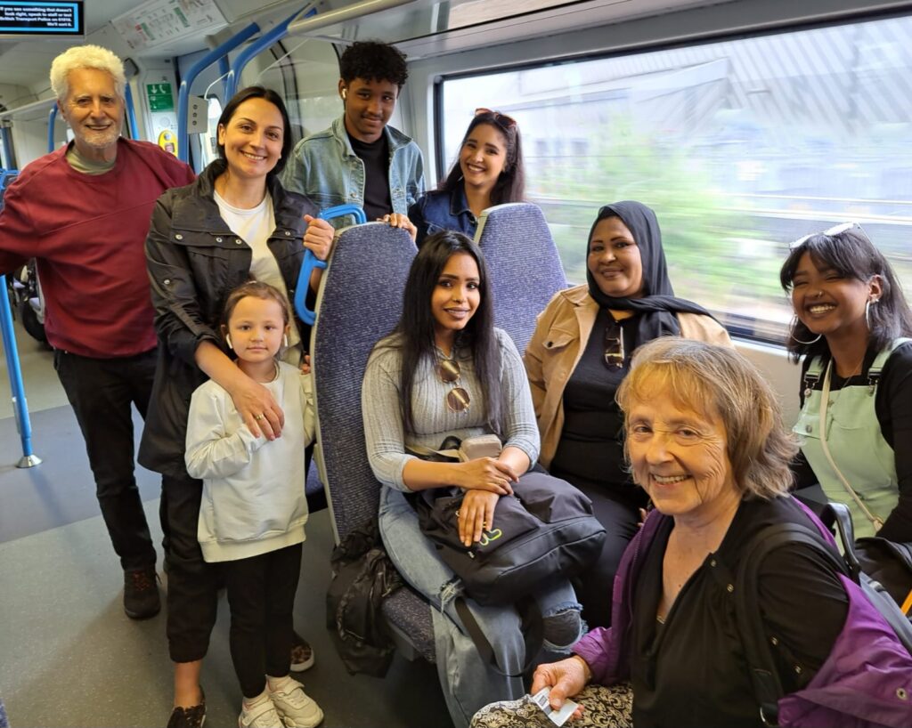 Photograph of a group of people on a train