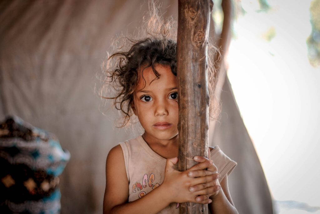 Photograph of a young Syrian girl looking at the camera