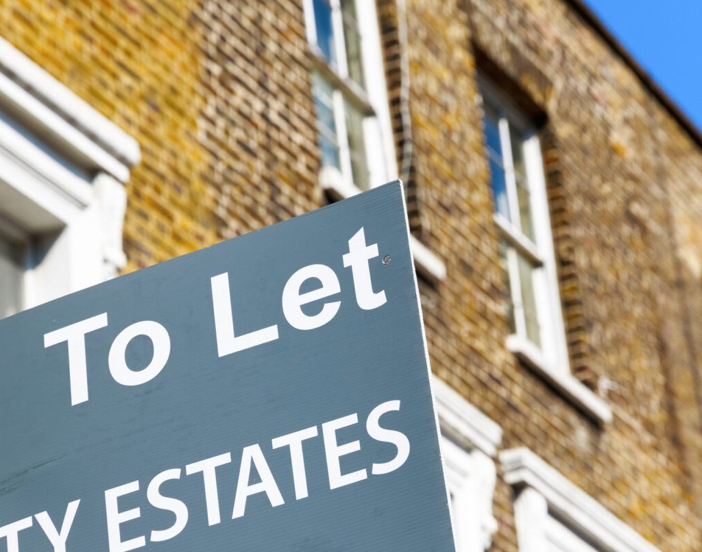 London, UK - April 8, 2017 - To Let property agency sign posted outside English terraced houses in Poplar, East London